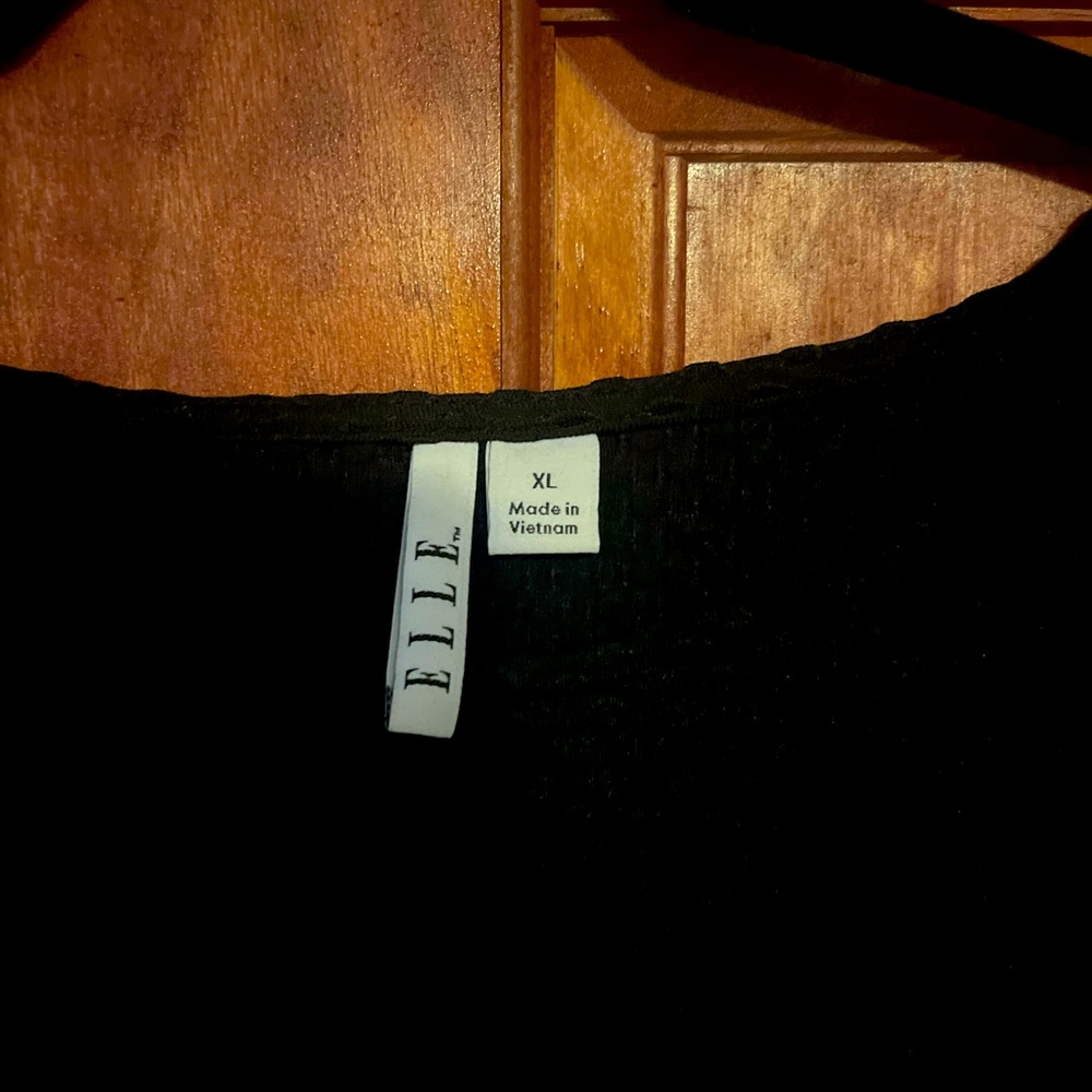 Elle brand mid length dress.  Black and stretchy.